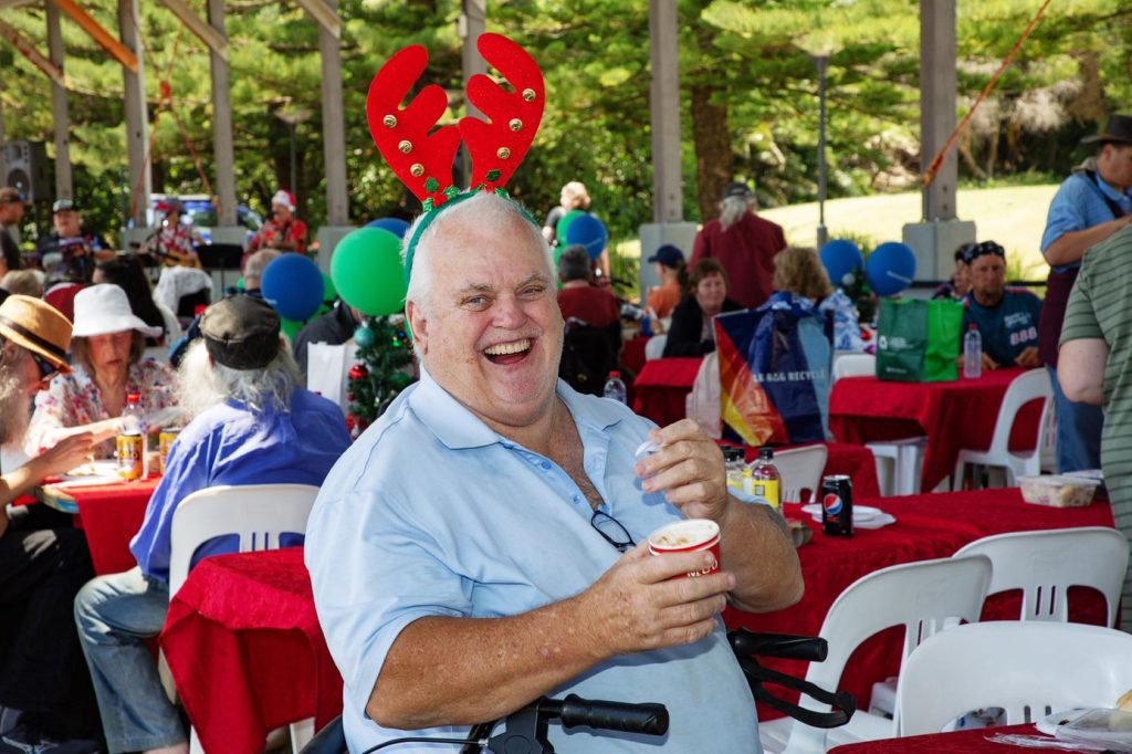 A happy man enjoys Christmas Lunch